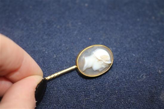 A 19th century yellow metal and sardonyx oval cameo stick pin, carved with the bust of Hermes to sinister, signed in Greek,